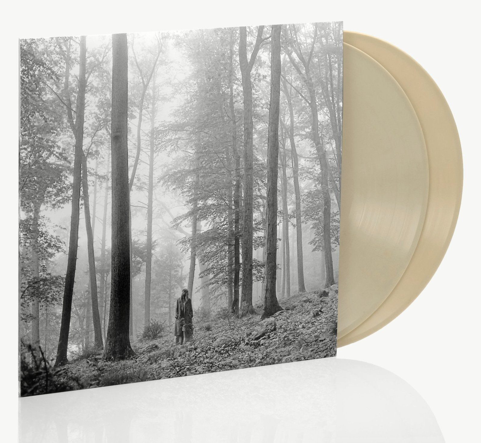 Folklore on vinyl: a misty black-and-white forest sleeve beside a pale record